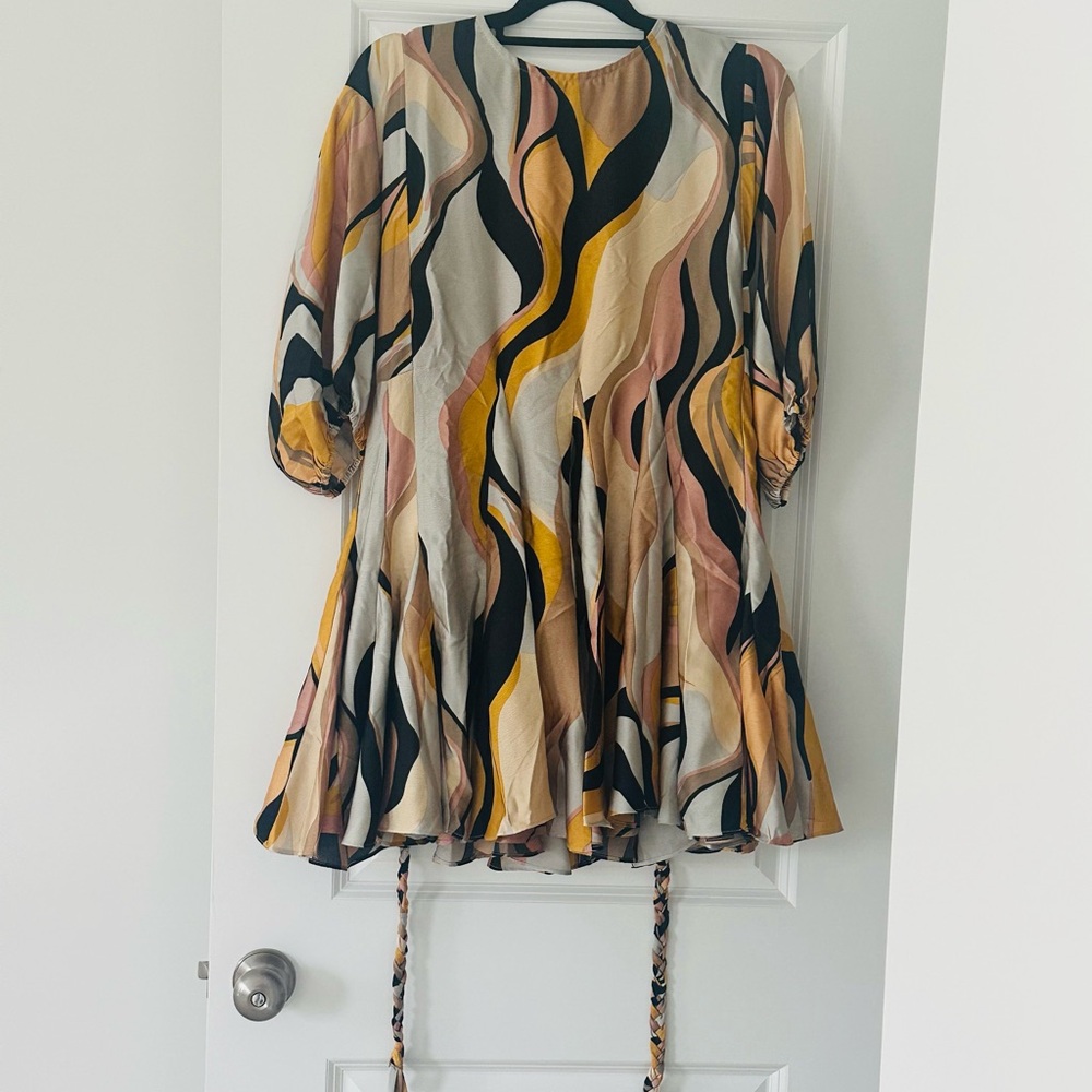 Aakaa Swirl Pattern Mini Dress in Black, Cream, and Tan